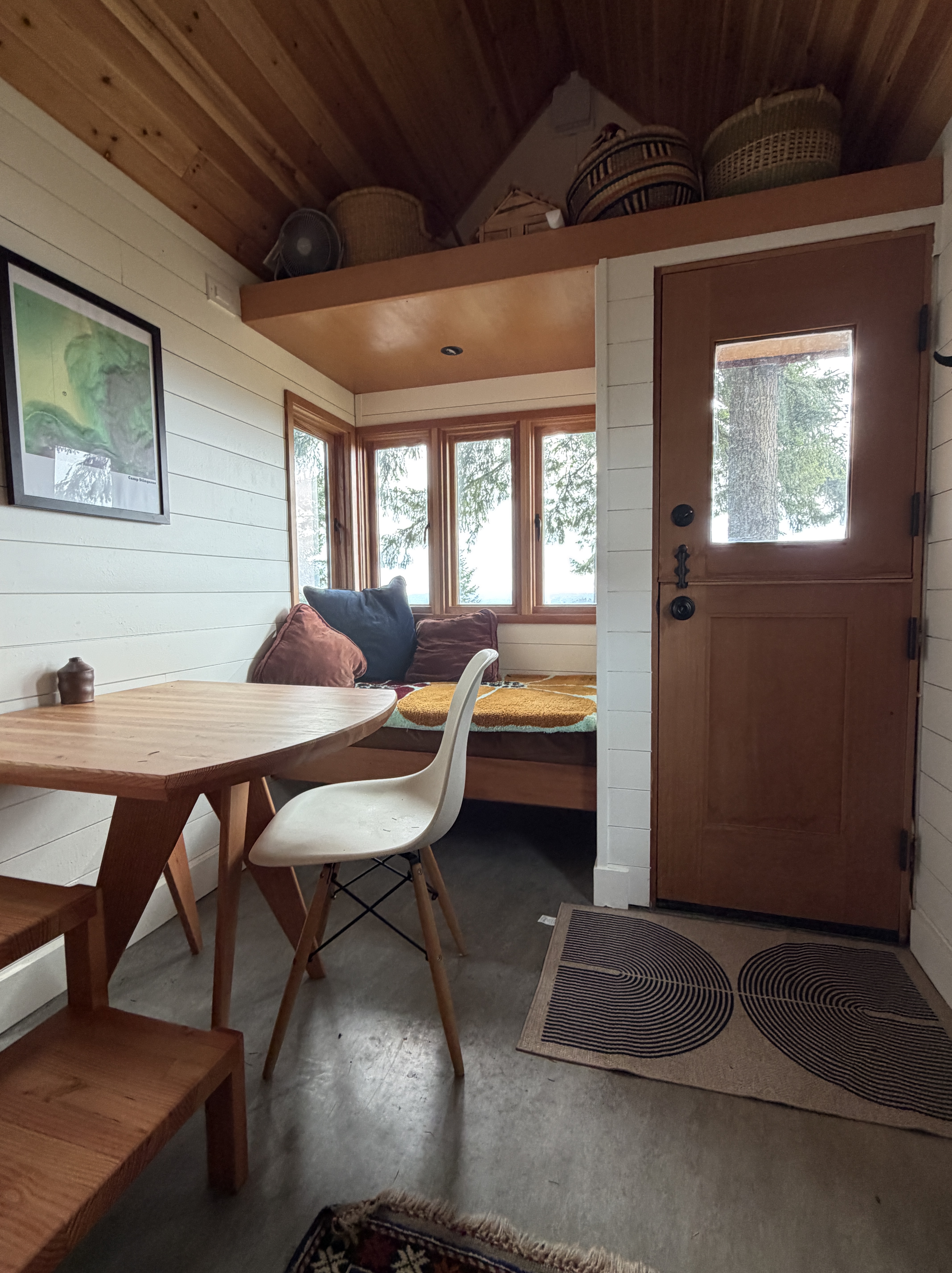 Interior sitting room with forest-view windows